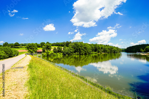 View of Lake Kreßbach and the surrounding landscape. Nature by the lake near Ellwangen.
