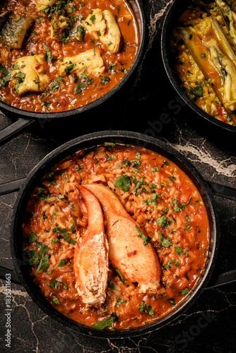 Portuguese traditional food fish soup  and seafood risotto meal on restaurant table in lisbon