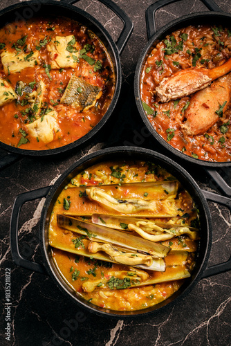 Portuguese traditional food fish soup  and seafood risotto meal on restaurant table in lisbon