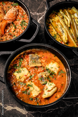 Portuguese traditional food fish soup  and seafood risotto meal on restaurant table in lisbon