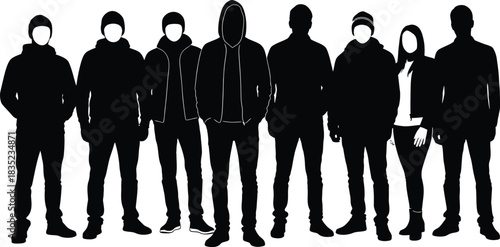 Silhouette of diverse group of people standing together in winter clothing