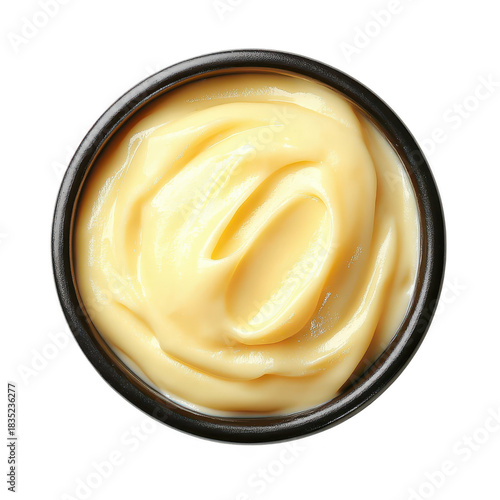 A close-up view of creamy mayonnaise in a black bowl. its smooth texture and rich color. ideal for culinary presentations or food-related content