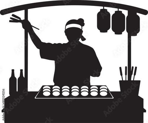 Silhouette of sushi chef preparing food at a street food stall
