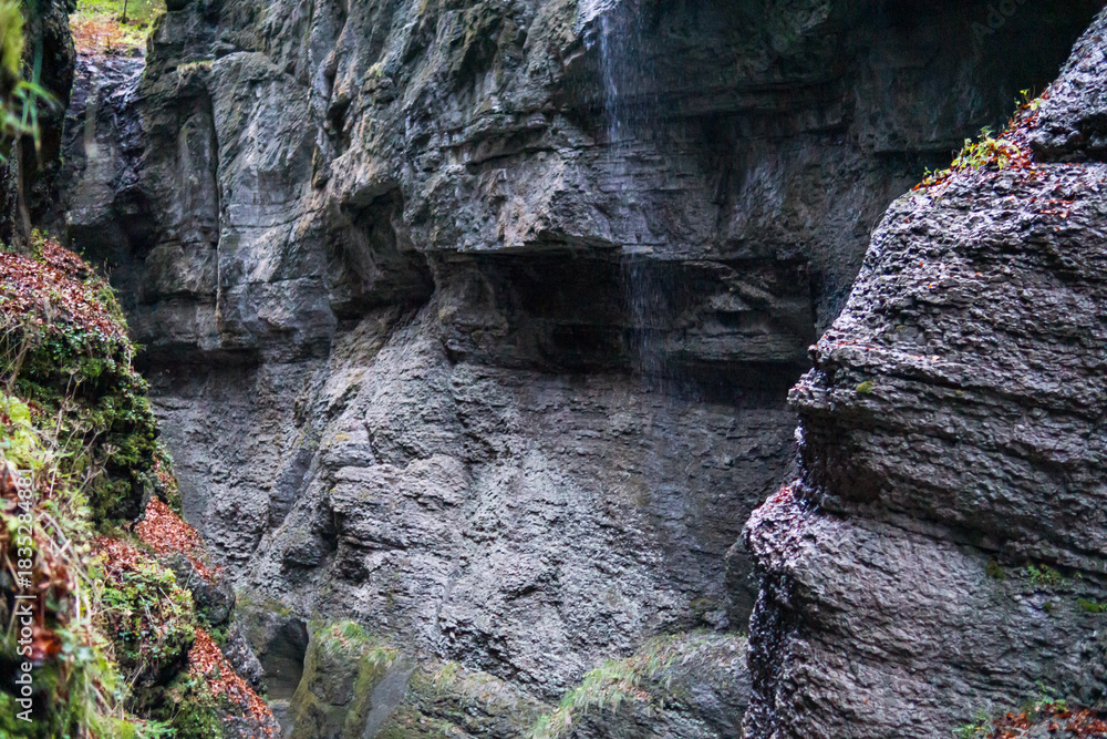 Fototapeta premium Rocky canyon walls with moss and water in Bavaria