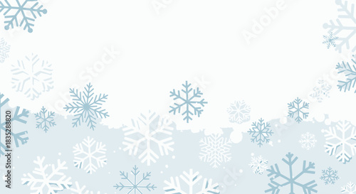 Elegant winter background with stylized snowflakes scattered on a light blue backdrop