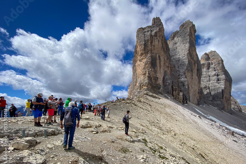 Group of hikers at Tre Cime trail below Cima Grande, Italy