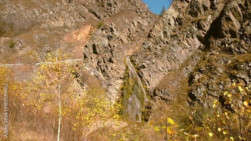 Picturesque mountain landscape with waterfall.