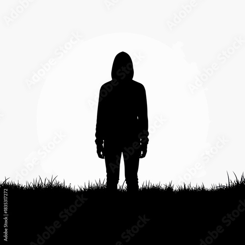 Dark silhouette of a mysterious anonymous person wearing a hoodie.