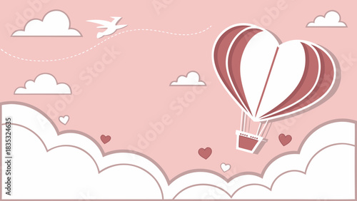 Heart shaped hot air balloon flying in a pink sky with clouds and a bird creating a romantic scene