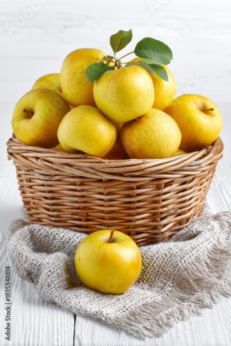 Basket of fresh yellow apples offering healthy food, vertical