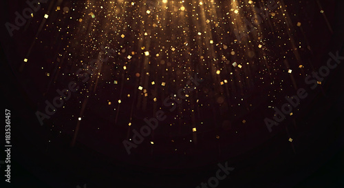 Golden light rays and glowing bokeh particles falling from top on dark background. Luxury abstract concept for awards ceremony, stage or divine magic