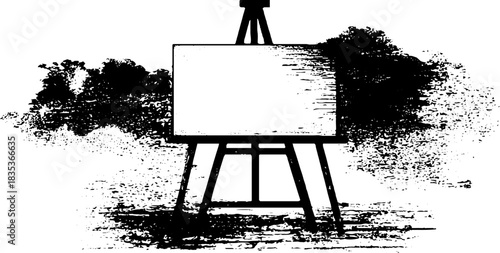 Black and white stencil of blank canvas on easel with artistic splatter design