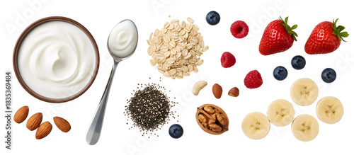 Ingredients for healthy breakfast including yogurt fruit and nuts flat lay