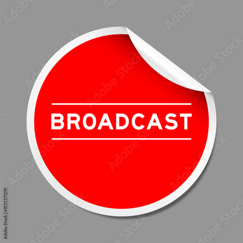 Red color peel sticker label with word broadcast on gray background