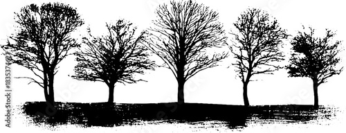 Black and white stencil of barren winter trees for seasonal art design