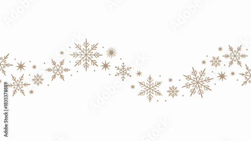Elegant wavy garland of delicate golden and silver snowflakes on a clean white background for winter holiday and christmas decorations