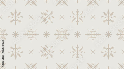 Seamless pattern of delicate pink and beige snowflakes in a repeating geometric arrangement on a light neutral background perfect for winter holidays and festive designs