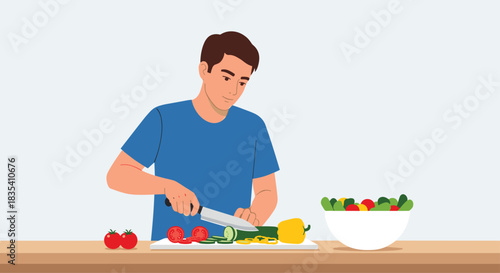 Young man diligently preparing fresh healthy salad ingredients with knife on cutting board