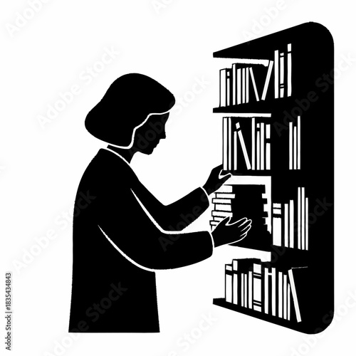 Silhouette of a person organizing books on a bookshelf.
