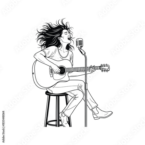 Passionate female singer playing acoustic guitar and singing into a vintage microphone on stage