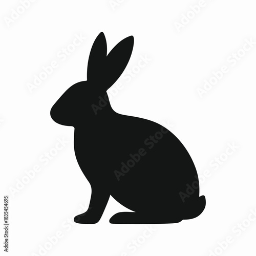 Sitting rabbit silhouette icon. Black bunny symbol