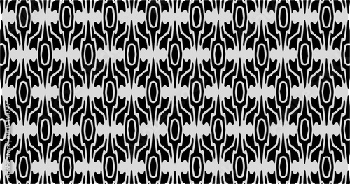 Black and white abstract pattern with repeating oval and curved shapes arranged in a complex seamless structure.
