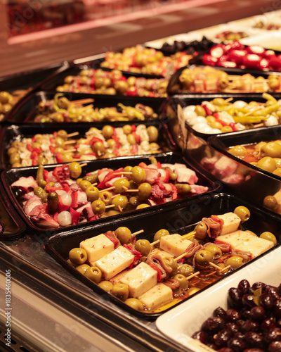 Photography Close-up Display of Skewered Spanish Tapas with Cheese, Olives, and Seafood at L