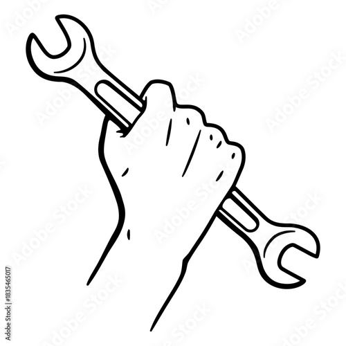 A hand holding a spanner wrench