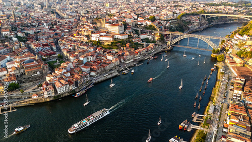 Cuadro en lienzo Sunset Drone View of Porto – Golden Hour Over the Douro River, Scenic Old Town, Cruise Ships, Riverside Architecture and Vibrant City Atmosphere