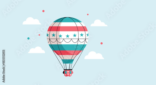 A hot air balloon with red, white, and blue stripes and stars floats in a light blue sky with clouds.