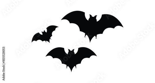 Three black bat silhouettes with spread wings on a white background for halloween decoration