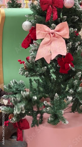 woman decorating Christmas tree