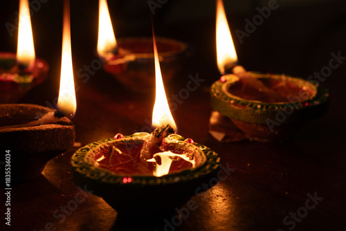 Portrait view of Karthigai deepam colorful oil lamp, a bright lights in the night