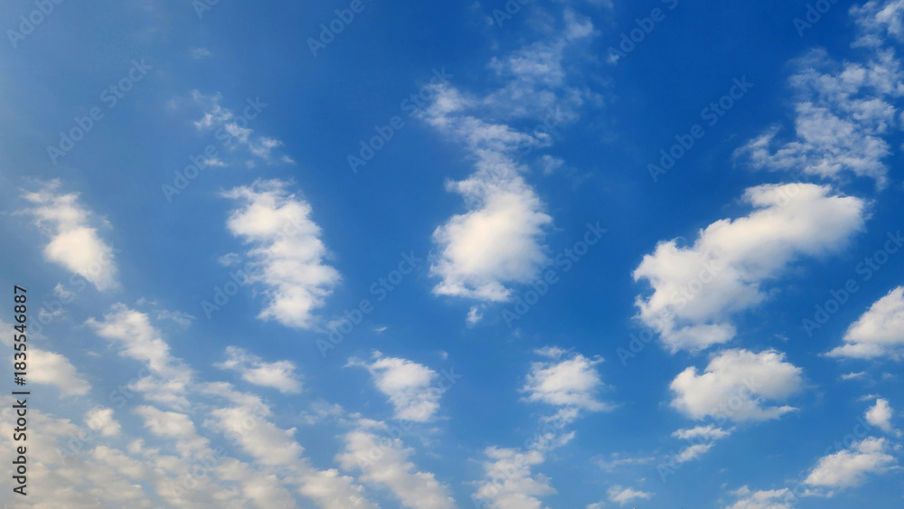 Fototapeta premium Mid-level cloud formation dominated by Altocumulus (Ac) clouds, composed of water droplets that organize into rounded patches or sheets (Altocumulus Stratiformis) signaling stable weather in Nov