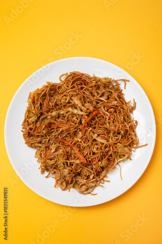 Chicken, pepper, and vegetables noodles on plate