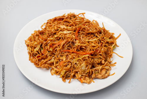 Chicken, pepper, and vegetables noodles on plate