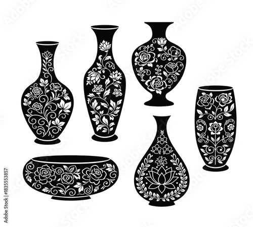 An exquisite collection of black ceramic vessels, including assorted vases and a decorative bowl, each intricately adorned with delicate white floral and leaf motifs in a classic oriental style. Ideal