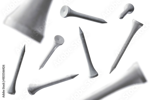 Several floating golf tees isolated from background