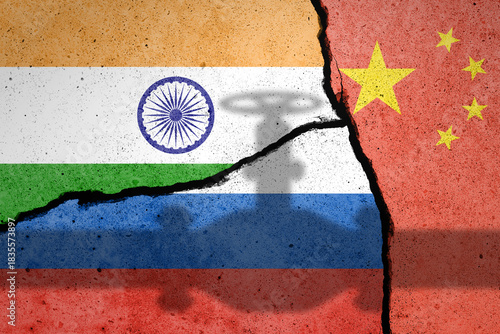 Flags of India, Russia and China painted on cracked wall with pipe shadow
