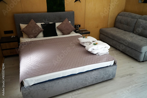 Comfortable hotel room in brown and gray tones