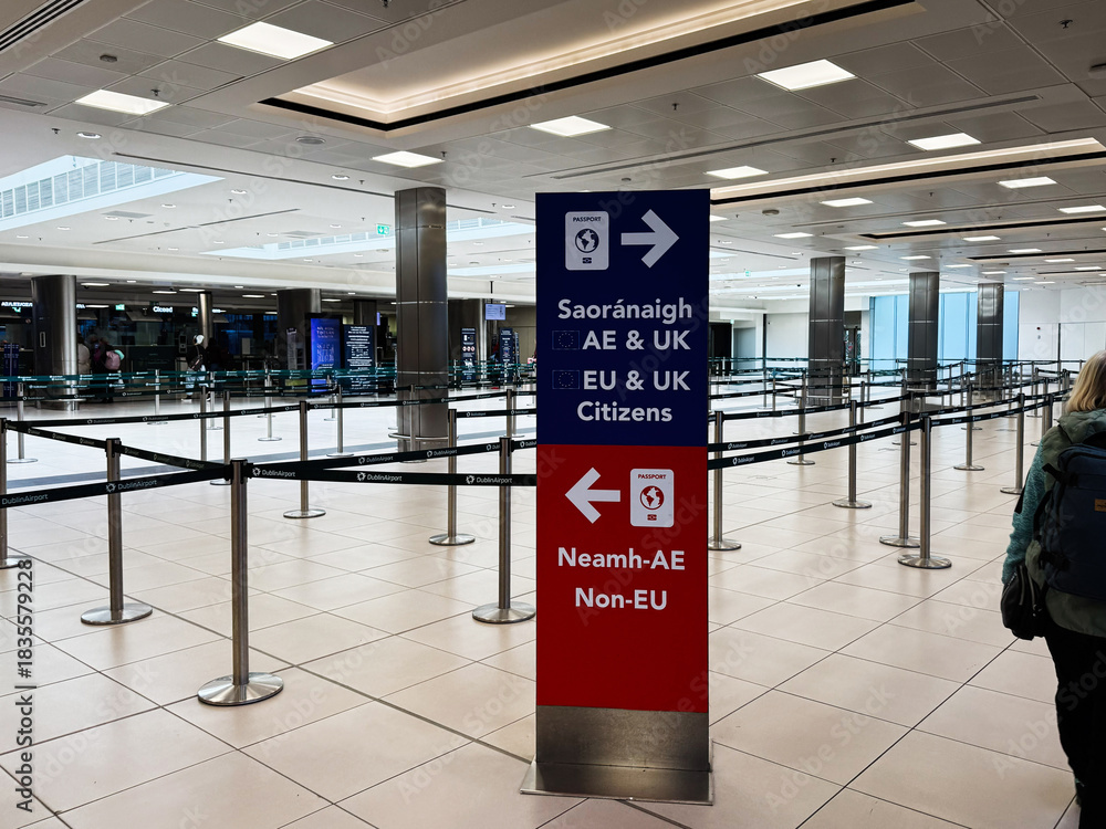 Obraz premium Busy Dublin Airport terminal in Ireland with directional sign for EU UK citizens and non EU travelers