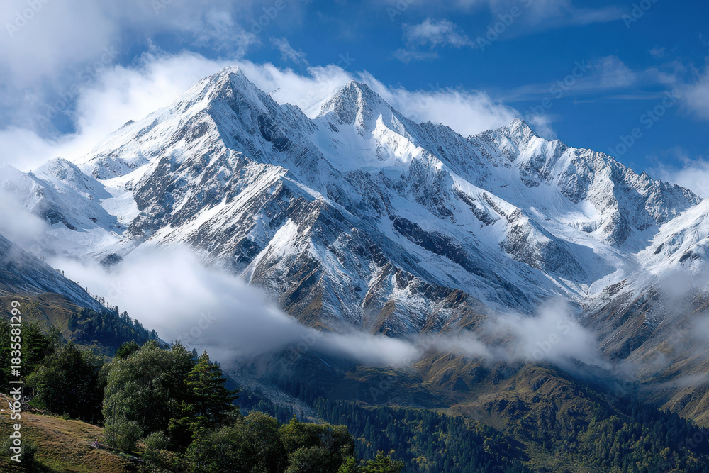 Fototapeta premium Snow Capped Mountain Peaks and Low Clouds