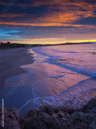 sunrise on long beach, tarragona, catalonia