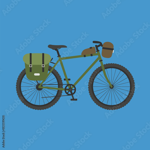 Green touring bicycle with panniers and handlebar bag.