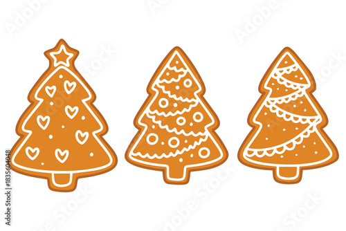 Set of fir tree shaped biscuits. Baked gingerbread spruces decorated with white sugar glaze ornaments for holiday celebration and sweet treat.