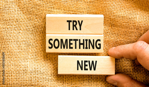 Try something new symbol. Concept words Try something new on beautiful block. Businessman's hand. Beautiful canvas background. Business motivational lifestyle try something new concept. Copy space.