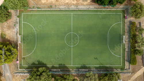 Aerial view of a five-a-side football pitch with artificial turf. The pitch is empty and outdoors.