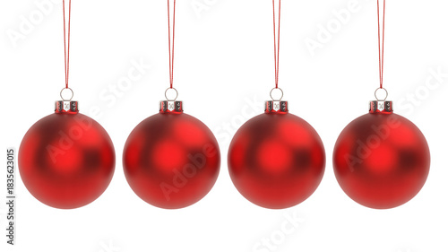 Four stunning matte red Christmas ornaments dangle against deep black background