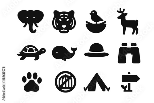 Wildlife Conservation Icons. Wildlife conservation. Solid icon set of wildlife conservation: elephant, tiger, bird nest, deer, turtle, whale, forest ranger