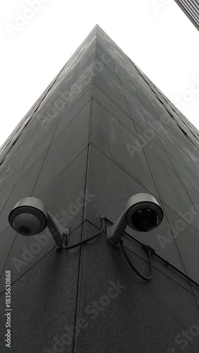 Security cameras on the corner of the tall building